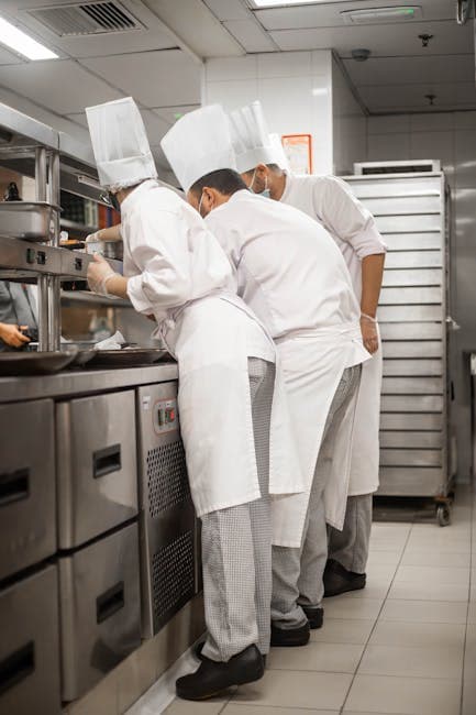 Chef in commercial kitchen preparing meals