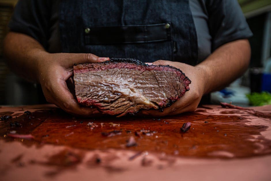 Smoked beef brisket on wooden cutting board