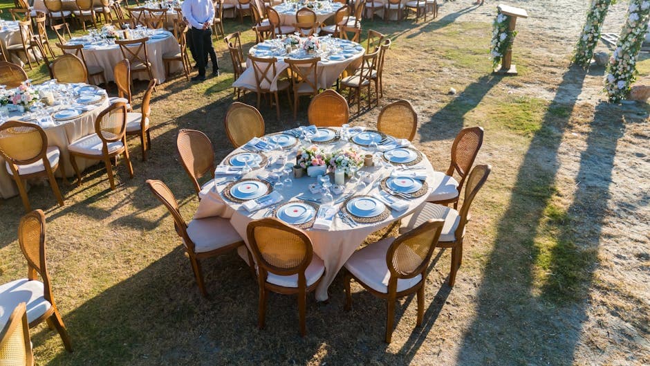 Outdoor wedding reception tables during golden hour